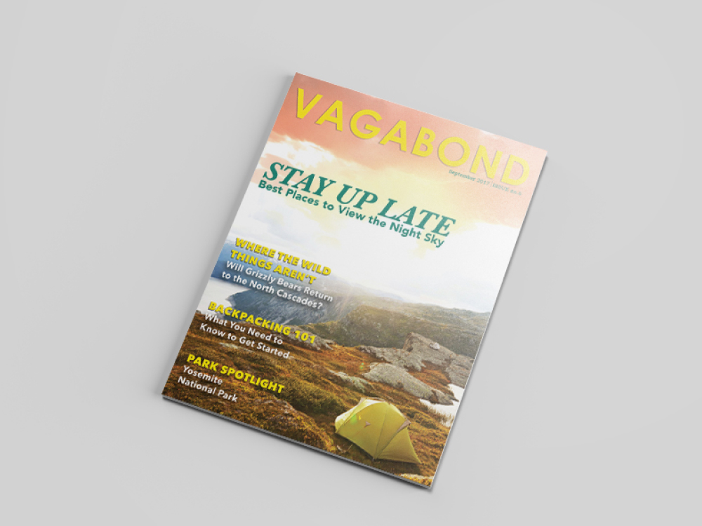 Cover of vagabond magazine depicting a yellow tent on the side of a seaside cliff. Varius articles are mentioned. done by Stephanie Reid Designs